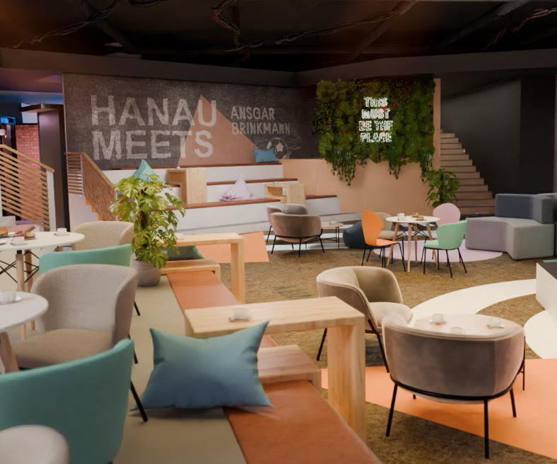 Lounge mit Sitztribüne, Pflanzenwand und Neon-Schriftzug «This must be the place»